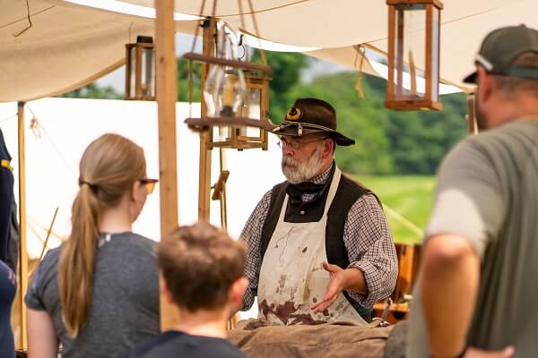 Visitors interact with living historians