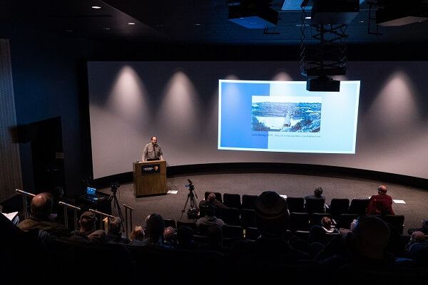 NPS Ranger presents talk at podium